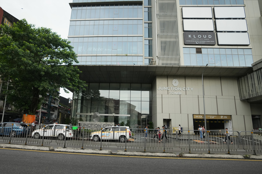Pedestrians walk past entrance of Junction City office tower Tuesday, Sept. 15, 2026, in Yangon, Myanmar. (AP Photo)