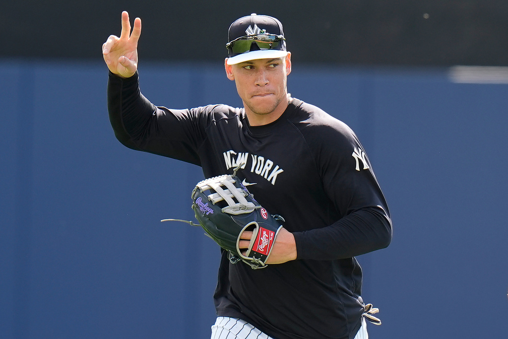 New York Yankees right fielder Aaron Judge waves to fans during a spring training baseball workout on Thursday, Feb. 12, 2026, in Tampa, Fla. (AP Photo/Chris O'Meara)