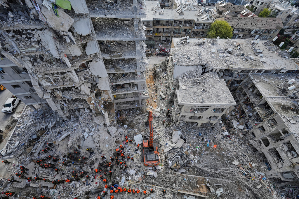 FILE - Israeli soldiers search through the rubble of residential buildings destroyed by an Iranian missile strike in Bat Yam, central Israel, June 15, 2025. (AP Photo/Baz Ratner, File)