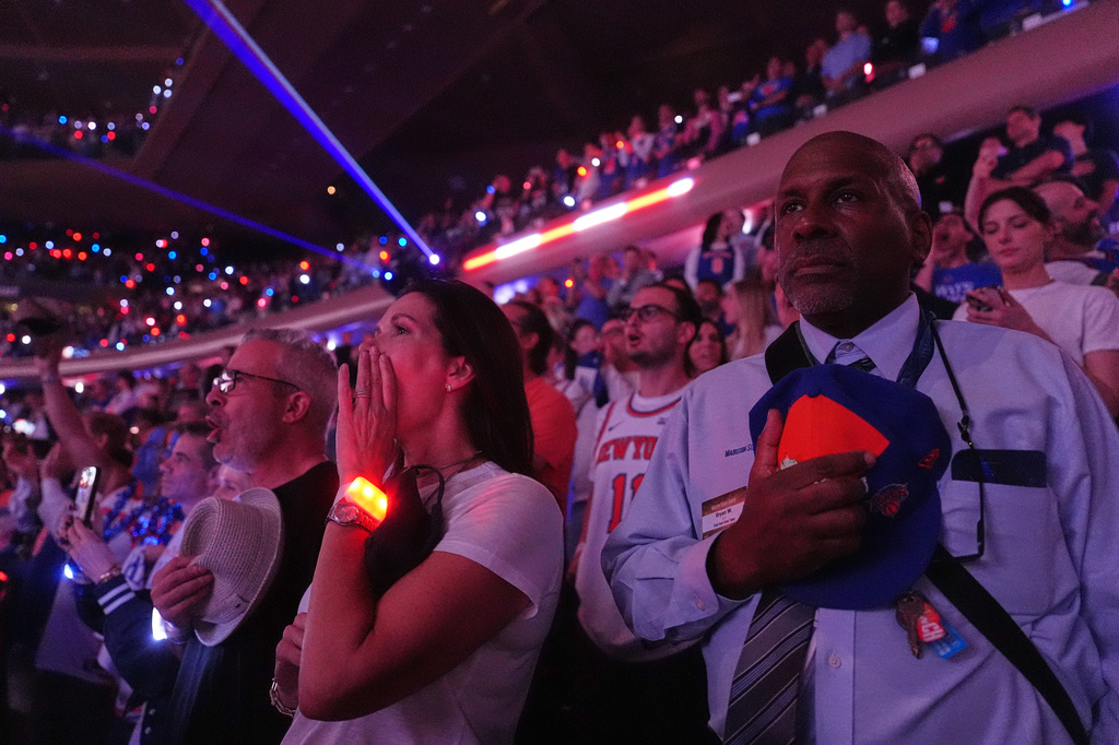 Fans cheer before a NBA Finals playoff basketball game between the New York Knicks and the San Antonio Spurs at Madison Square Garden in New York, Monday, June 8, 2026, with Kai Trump. (AP Photo/Mark Schiefelbein)