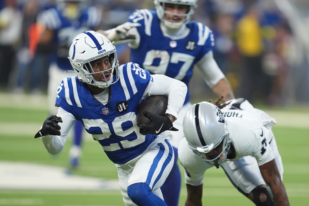 Indianapolis Colts cornerback Mekhi Blackmon (29) runs back an interception during the second half of an NFL football game against the Las Vegas Raiders, Sunday, Oct. 5, 2025, in Indianapolis. (AP Photo/Michael Conroy)