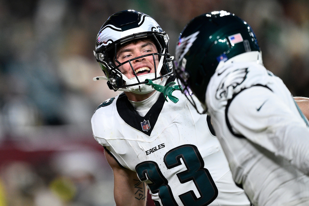 Philadelphia Eagles cornerback Cooper Dejean (33) celebrates after an interception against the Washington Commanders during the second half of an NFL football game, Saturday, Dec. 20, 2025, in Landover, Md. (AP Photo/Nick Wass)