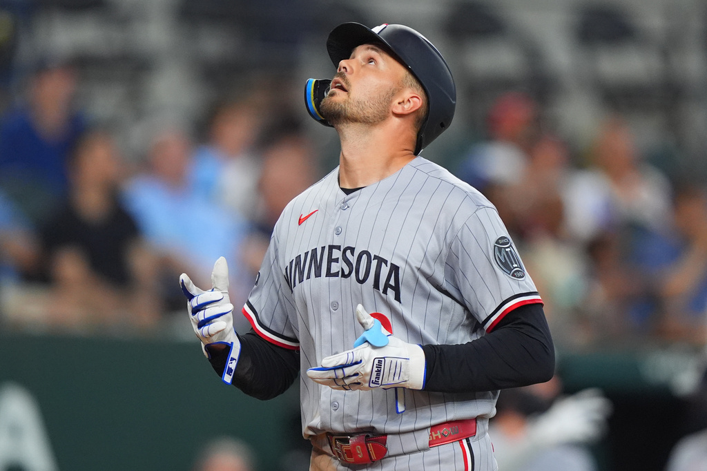 Minnesota Twins' Trevor Larnach celebrates his home run during the fourth inning of a baseball game against the Texas Rangers, Thursday, June 18, 2026, in Arlington, Texas. (AP Photo/LM Otero)