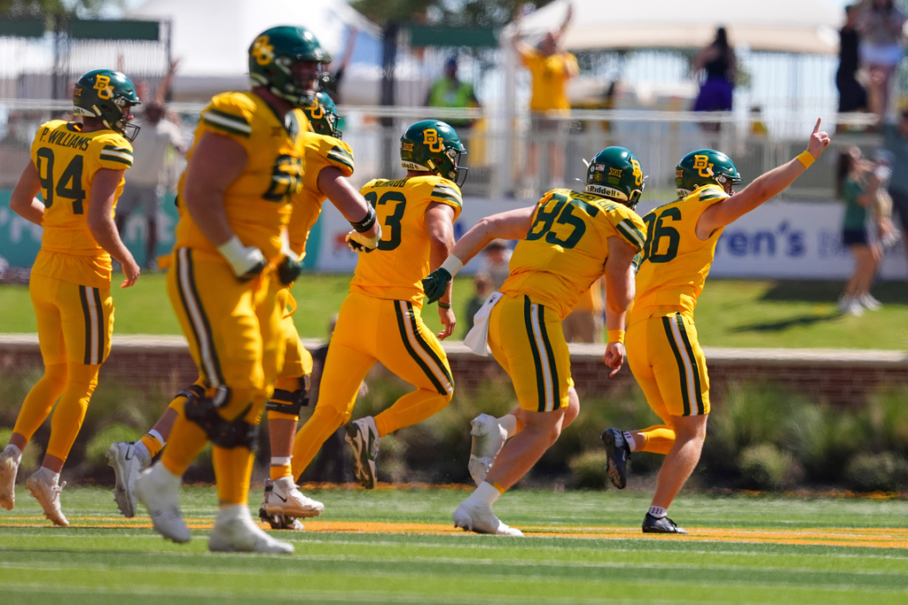 Baylor kicker Connor Hawkins (96), far right, reacts after kicking a 53-yard field goal during the second half of an NCAA college football game against Kansas State, Saturday, Oct. 4, 2025, in Waco, Texas. (AP Photo/Ronaldo Bolaños)