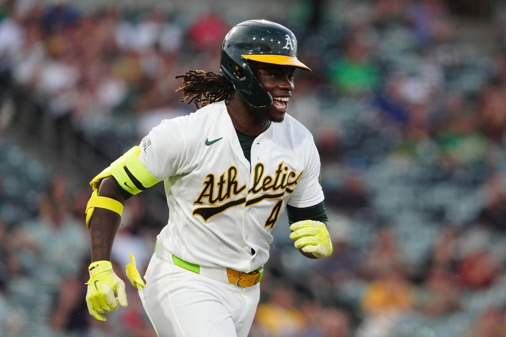 Athletics' Lawrence Butler reacts as he runs to first base after hitting a single in the fourth inning during a baseball game against the Minnesota Twins Tuesday, Aug. 25, 2026, in West Sacramento, Calif. (AP Photo/Alan Greth)
