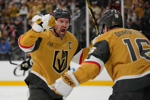 Vegas Golden Knights right wing Mark Stone (61) celebrates after Pavel Dorofeyev, right, scored against the Los Angeles Kings during the second period of an NHL hockey game Wednesday, Oct. 8, 2025, in Las Vegas. (AP Photo/John Locher) Vegas Golden Knights right wing Mark Stone (61) celebrates after Pavel Dorofeyev, right, scored against the Los Angeles Kings during the second period of an NHL hockey game Wednesday, Oct. 8, 2025, in Las Vegas. (AP Photo/John Locher)