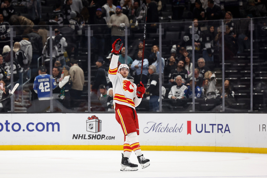 Calgary Flames right wing Adam Klapka (43) reacts after the Calgary Flames defeated Los Angeles Kings of an NHL hockey game Saturday, Dec. 13, 2025, in Los Angeles. (AP Photo/Caroline Brehman)