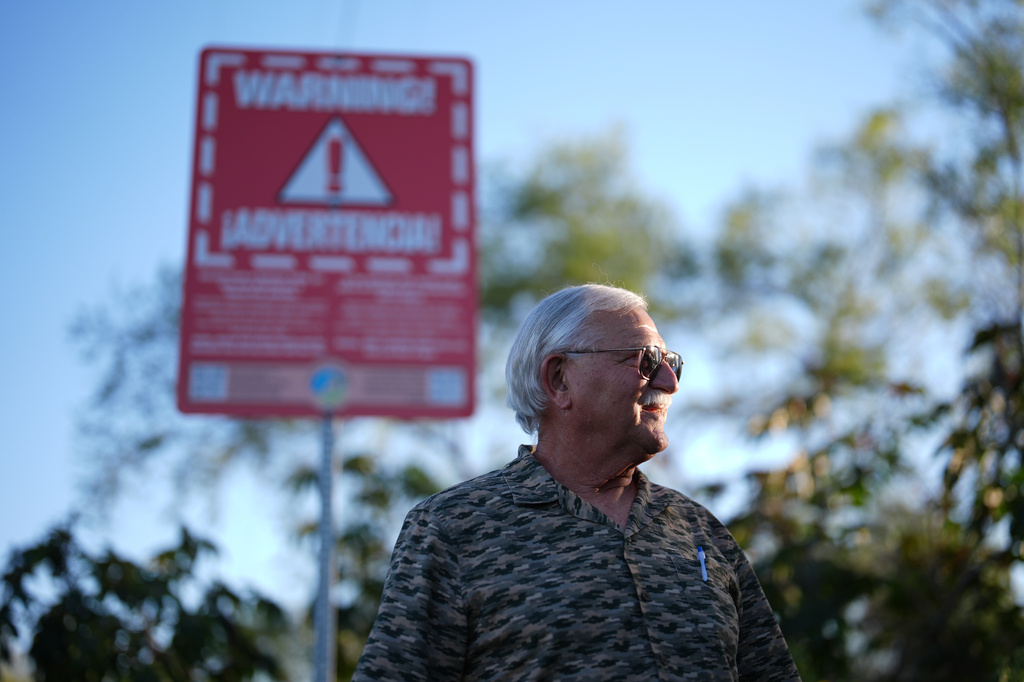 Steve Egger stands near what scientists call "the Saturn hot spot," a section of the Tijuana River where the contaminated water splashes out of pipes and creates pools of foam near his home Friday, March 6, 2026, in San Diego. (AP Photo/Gregory Bull)