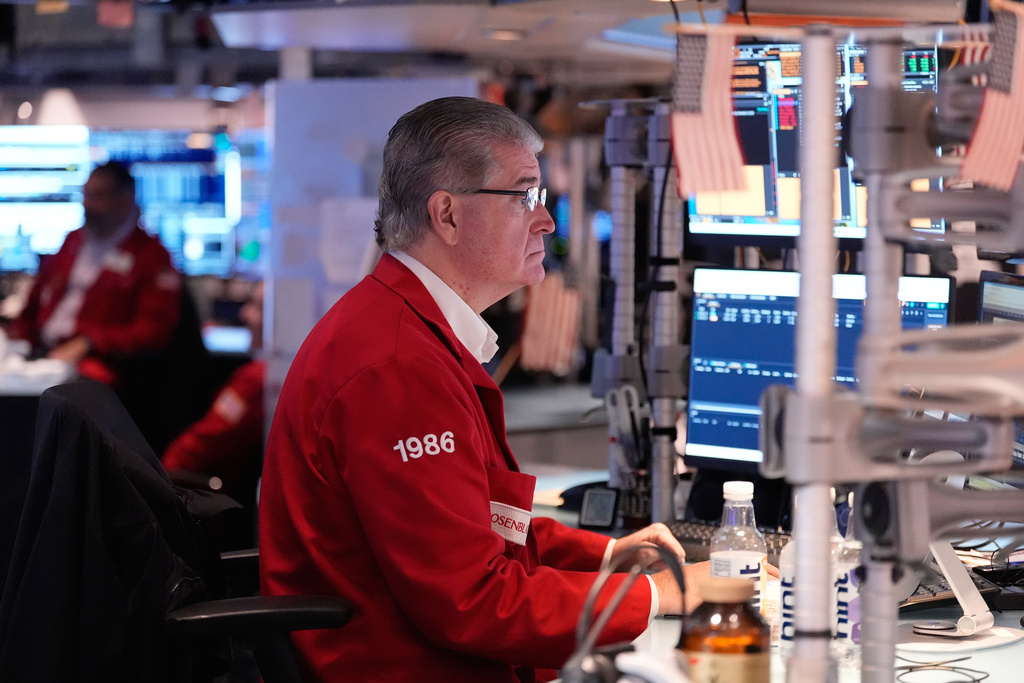 Daniel Kryger works on the floor at the New York Stock Exchange in New York, Thursday, Nov. 13, 2025. (AP Photo/Seth Wenig)