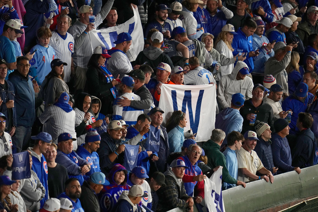 Chicago Cubs fans celebrate after Game 4 of baseball's National League Division against the Milwaukee Brewers Series Thursday, Oct. 9, 2025, in Chicago. (AP Photo/Erin Hooley)