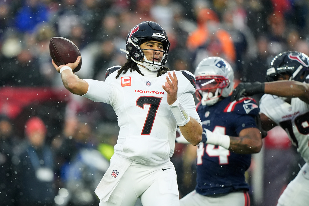 Houston Texans quarterback C.J. Stroud (7) throws a touchdown pass to wide receiver Christian Kirk against the New England Patriots during the first half of an NFL divisional playoff football game, Sunday, Jan. 18, 2026, in Foxborough, Mass. (AP Photo/Robert F. Bukaty)