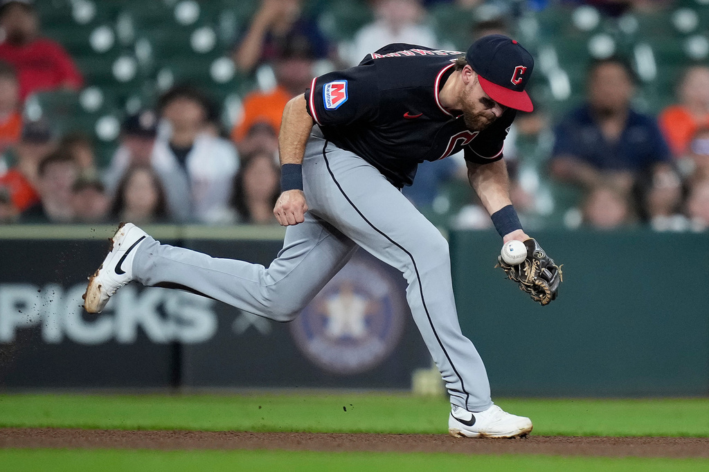 Cleveland Guardians third baseman Daniel Schneemann fields a ground ball hit by Houston Astros' Cam Smith during the fourth inning of a baseball game Saturday, June 20, 2026, in Houston. (AP Photo/Kevin M. Cox)
