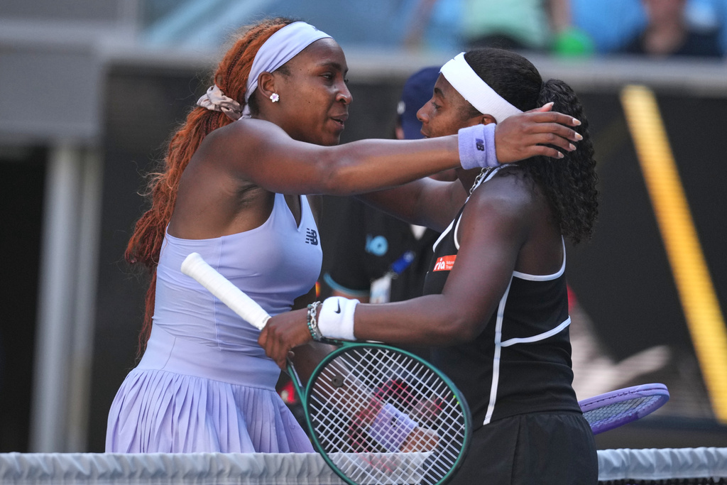 Coco Gauff, left, of the U.S. is congratulated by compatriot Hailey Baptiste following their third round match at the Australian Open tennis championship in Melbourne, Australia, Friday, Jan. 23, 2026. (AP Photo/Dita Alangkara)