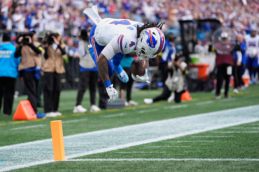 Buffalo Bills running back James Cook III (4) jumps into the end zone for a touchdown against the Carolina Panthers during the first half an NFL football game, Sunday, Oct. 26, 2025, in Charlotte, N.C. (AP Photo/Jacob Kupferman) Buffalo Bills running back James Cook III (4) jumps into the end zone for a touchdown against the Carolina Panthers during the first half an NFL football game, Sunday, Oct. 26, 2025, in Charlotte, N.C. (AP Photo/Jacob Kupferman)