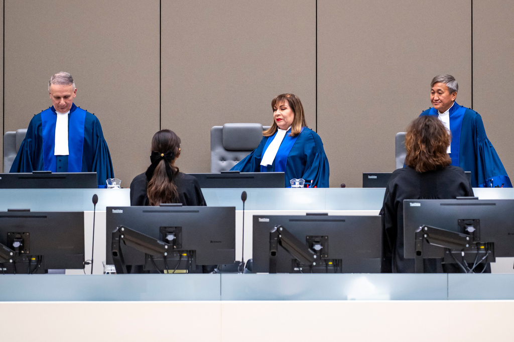 Judges enter the court room of the International Criminal Court (ICC) to rule on a request to release former Philippine President Rodrigo Duterte, in The Hague, Netherlands, Friday, Nov. 28, 2025. (Lina Selg/Pool Photo via AP)