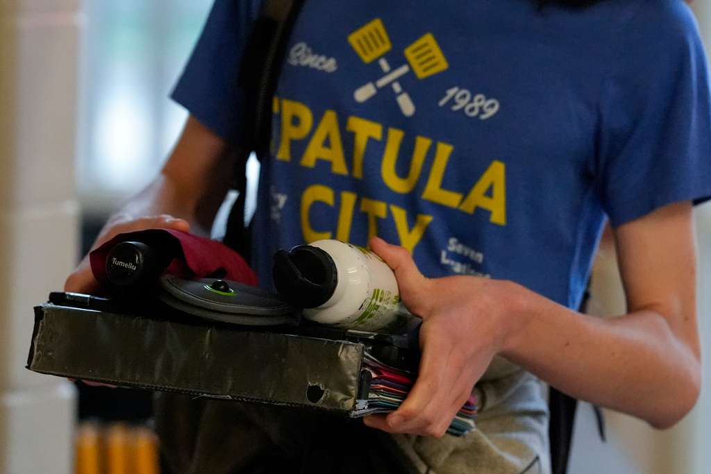 A student walks through a secure entrance at Midtown High School, Friday, March 6, 2026, in Atlanta. (AP Photo/Mike Stewart)