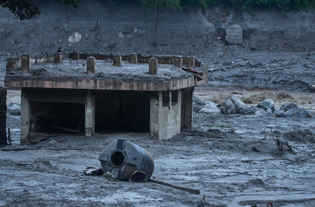 Damage is seen in the aftermath of flash floods in Devighat in the Nuwakot district in Nepal, Thursday, Aug. 27, 2026. (AP Photo/Niranjan Shrestha)