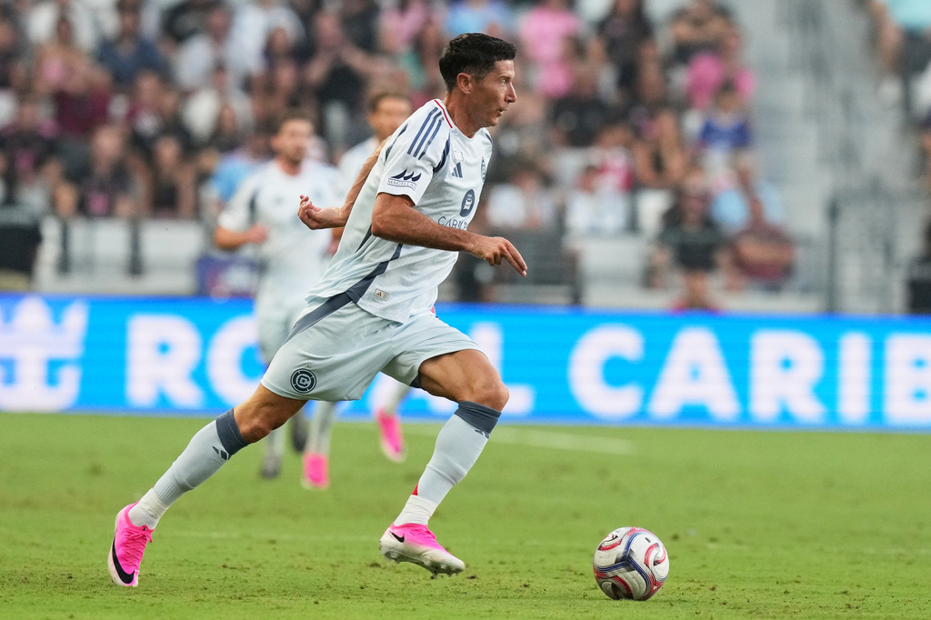 Chicago Fire forward Robert Lewandowski runs with the ball during the first half of an MLS soccer match against Inter Miami, Wednesday, July 22, 2026, in Miami. (AP Photo/Lynne Sladky)