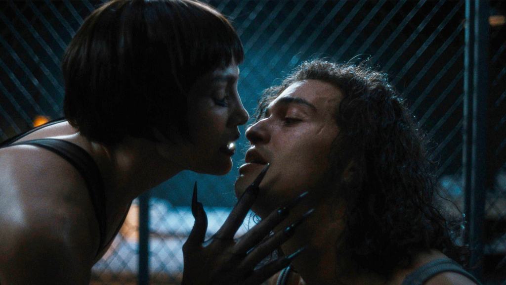 This image released by Roadside Attractions shows Jennifer Lopez, left, and Tonatiuh in a scene from "Kiss of The Spider Woman." (Roadside Attractions via AP)