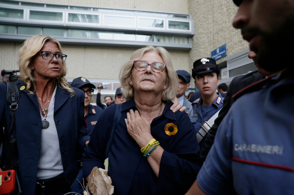 Paola Deffendi, Giulio Regeni's mother, center, reacts with emotion as she leaves a courtroom after three of four Egyptian security officials were convicted to 10 years in prison for the abduction and murder of her son in Cairo in 2016, in Rome, Monday, Sept. 28, 2026. (Cecilia Fabiano/LaPresse via AP)
