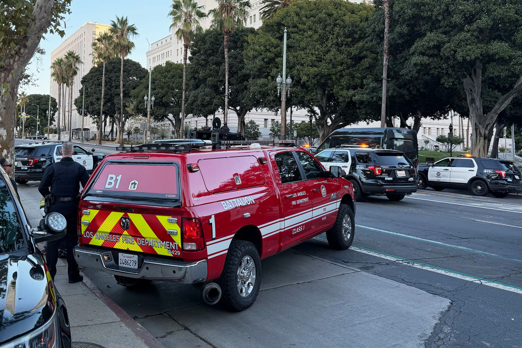 Law enforcement responds after a car crashed into Los Angeles City Hall on Friday, Oct. 3, 2025. (AP Photo/Jaimie Ding)