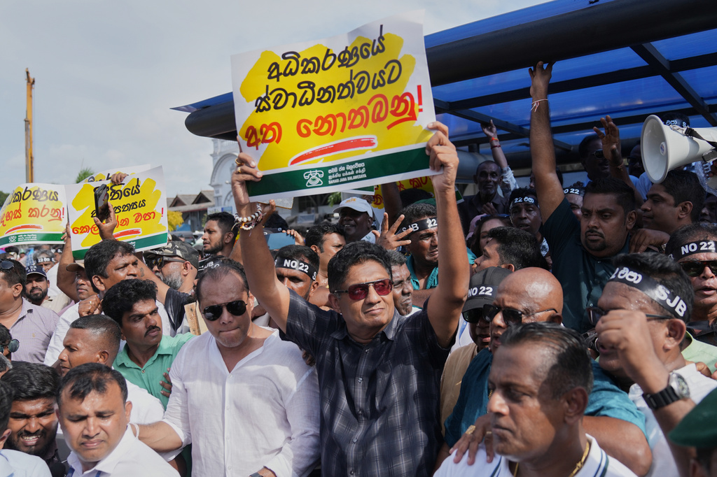 Sri Lanka's opposition leader Sajith Premadasa holds a placard reading "Hands off independence of judiciary" during a protest in Colombo, Sri Lanka, Thursday, Sept. 3, 2026. (AP Photo/Eranga Jayawardena)