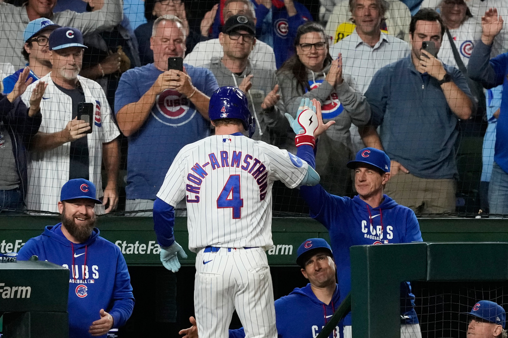 Chicago Cubs' Pete Crow-Armstrong (4) is congratulated by manager Craig Counsell after hitting a two-run home run during the sixth inning of a baseball game against the Atlanta Braves in Chicago, Monday, Sept. 14, 2026. (AP Photo/Nam Y. Huh)