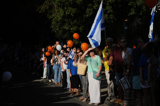 People gather to welcome freed Israeli hostage Evyatar David, recently released from Hamas captivity in Gaza, as he returns home from the hospital to Kfar Saba, Israel, Sunday, Oct. 26, 2025. (AP Photo/Ariel Schalit) People gather to welcome freed Israeli hostage Evyatar David, recently released from Hamas captivity in Gaza, as he returns home from the hospital to Kfar Saba, Israel, Sunday, Oct. 26, 2025. (AP Photo/Ariel Schalit)
