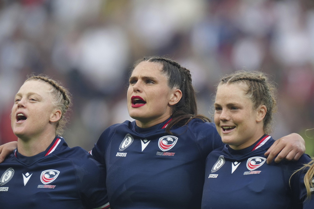 USA's Ilona Maher, center, sings during the national anthem before the group A match at the 2025 Women's Rugby World Cup between England and the United States in Sunderland, England, Friday, Aug. 22, 2025. (Mike Egerton/PA via AP)