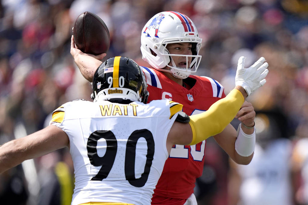 New England Patriots quarterback Drake Maye (10) throws against Pittsburgh Steelers outside linebacker T.J. Watt (90) during the first half of an NFL football game, Sunday, Sept. 21, 2025, in Foxborough, Mass. (AP Photo/Robert F. Bukaty)