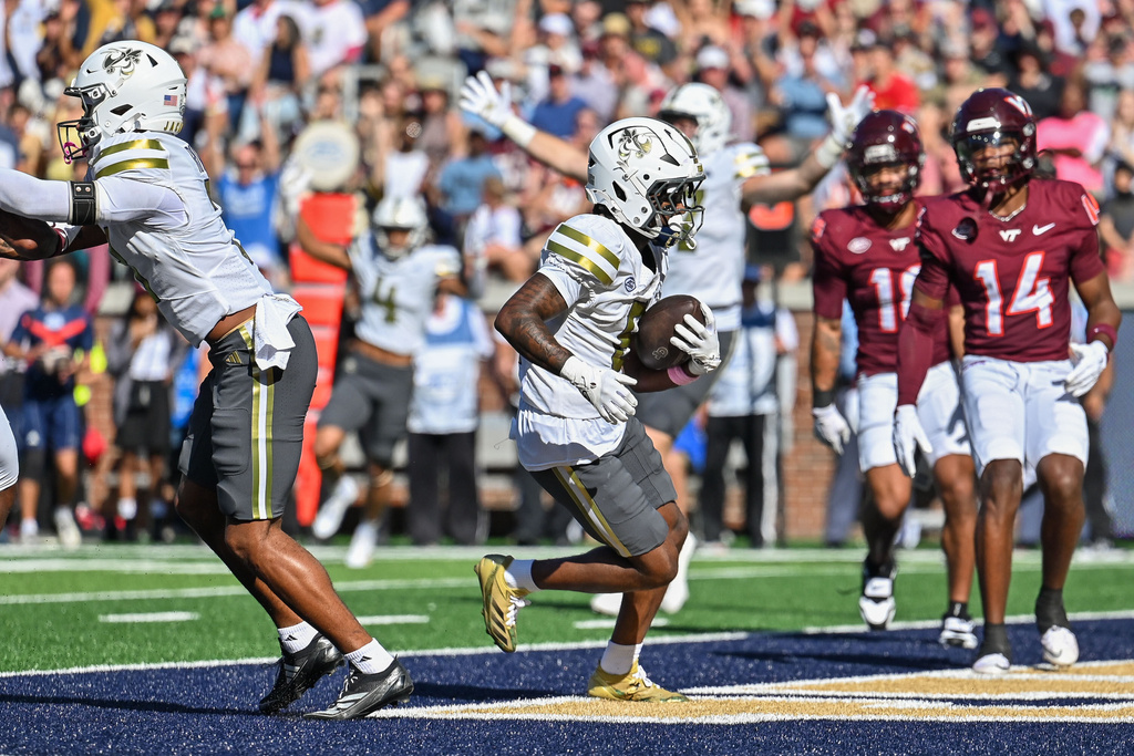 Georgia Tech wide receiver Malik Rutherford (8) carries the ball into the end zone for a touchdown against Virginia Tech during the first half of an NCAA college football game, Saturday, Oct. 11, 2025 at Bobby Dodd Stadium in Atlanta. (Daniel Varnado/Atlanta Journal-Constitution via AP)