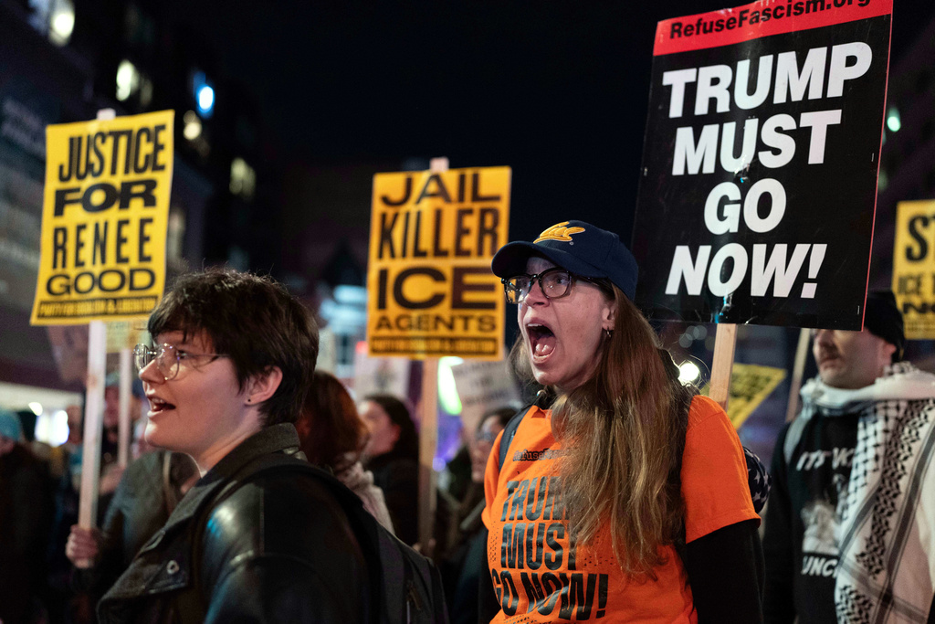 Demonstrators rally before marching to the White House in Washington, Thursday, Jan. 8, 2026, as they protest against the Immigration and Customs Enforcement (ICE) agent who fatally shot Renee Nicole Good in Minneapolis. (AP Photo/Jose Luis Magana)