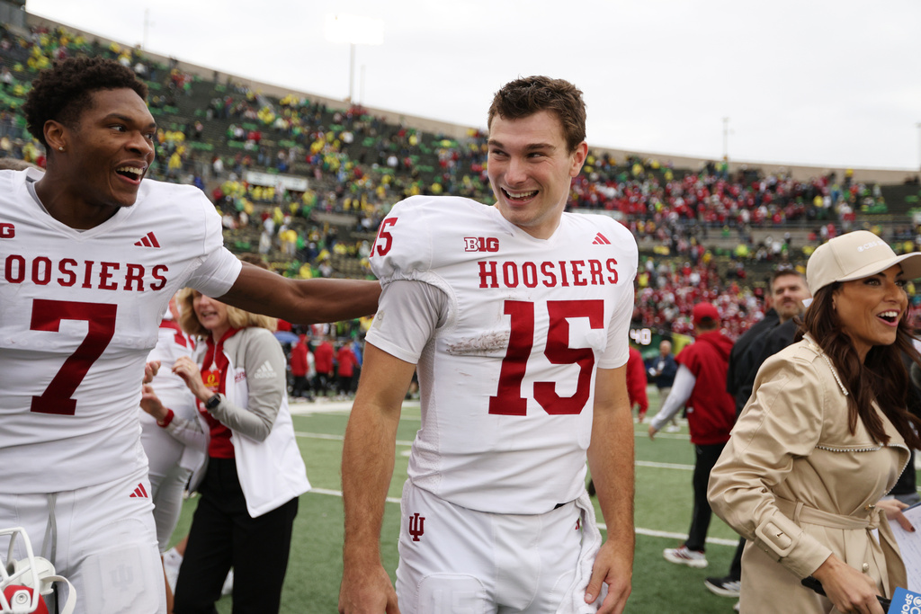Indiana wide receiver E.J. Williams Jr. (7) and quarterback Fernando Mendoza (15) celebrate after an NCAA college football game against Oregon, Saturday, Oct. 11, 2025, in Eugene, Ore. (AP Photo/Lydia Ely)