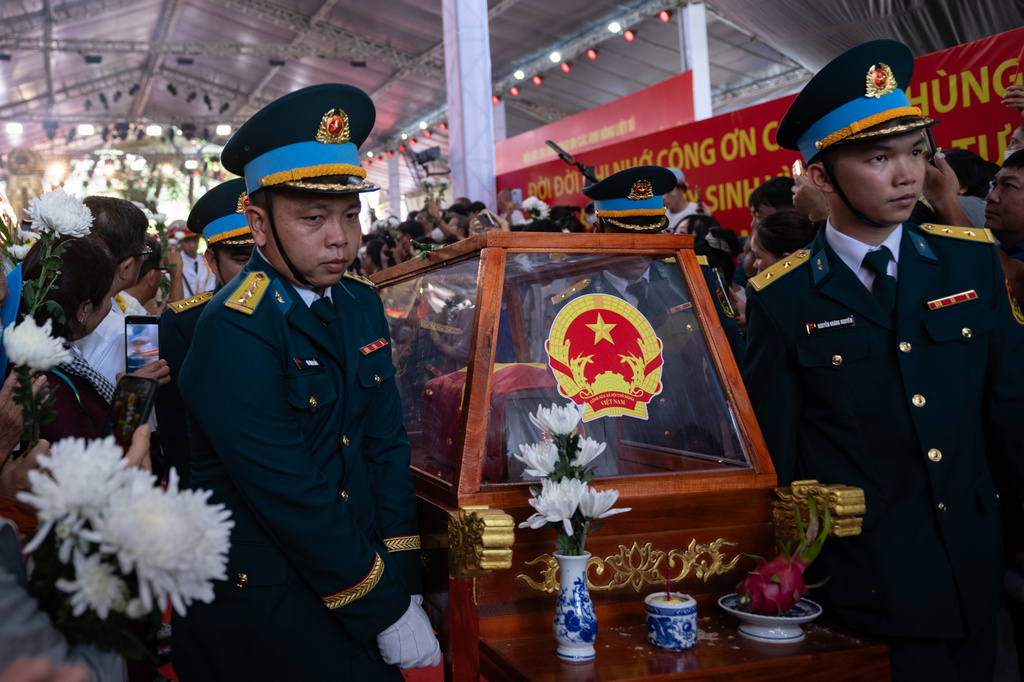 Military personnel carry the remains of 731 martyrs' remains found at Le Thi Rieng Cultural Park for burial at Ho Chi Minh City Martyrs' Cemetery Wednesday, Oct. 14, 2026, in Ho Chi Minh City, Vietnam. (AP Photo/Thanh Hue)