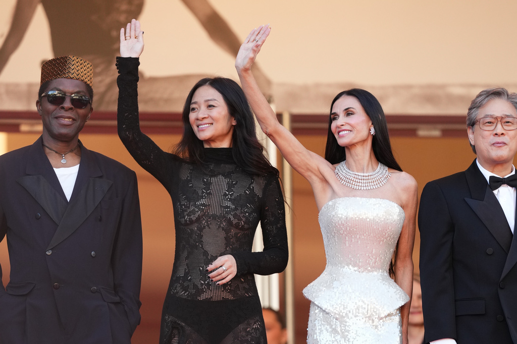 Jury president Park Chan-wook, fourth from left, poses with jury members Isaach de Bankolé, from left, Chloé Zhao and Demi Moore at the opening ceremony and premiere of the film 'The Electric Kiss' during 79th international film festival, Cannes, southern France, Tuesday, May 12, 2026. (Photo by Scott A Garfitt/Invision/AP)
