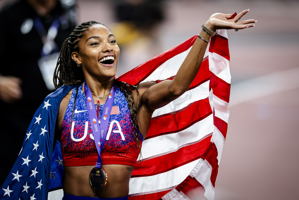 United States' Tara Davis-Woodhall celebrates after winning the gold medal in the women's long jump final at the World Athletics Championships in Tokyo, Sunday, Sept. 14, 2025. (Michael Buholzer, Keystone via AP)