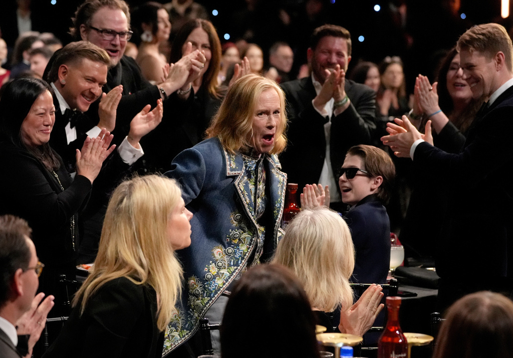 FILE - Amy Madigan, center, reacts to winning the award for best supporting actress for "Weapons" during the 31st Annual Critics Choice Awards in Santa Monica, Calif., on Jan. 4, 2026. (AP Photo/Chris Pizzello, File)