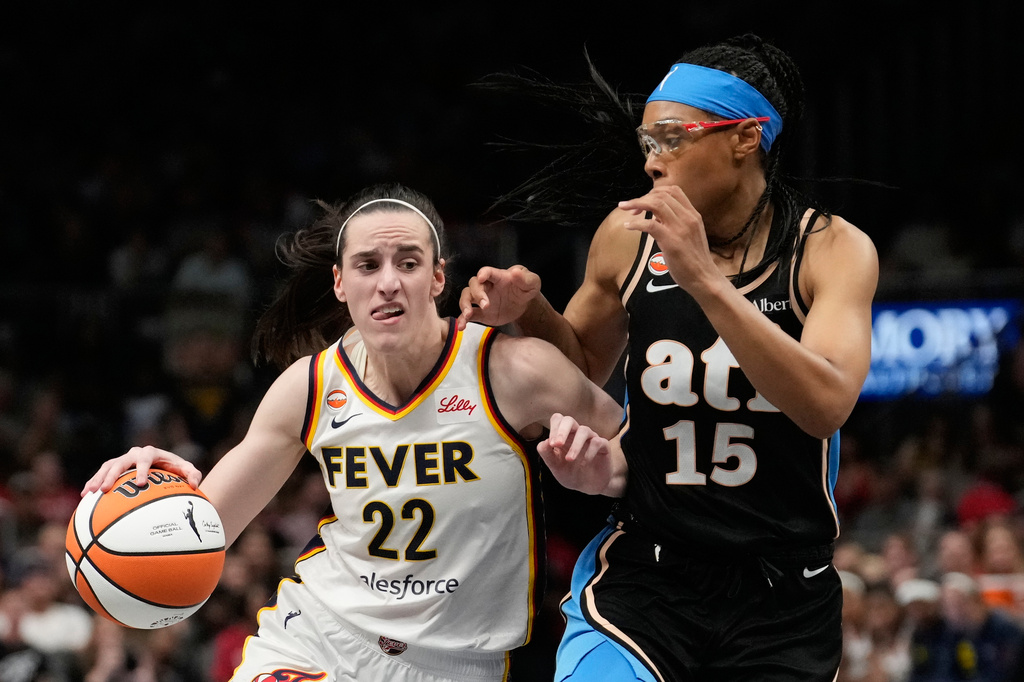 Indiana Fever guard Caitlin Clark (22) dribbles against Atlanta Dream guard Allisha Gray (15) in the overtime during an WNBA basketball game Sunday, Aug. 16, 2026, in Atlanta. (AP Photo/Brynn Anderson)