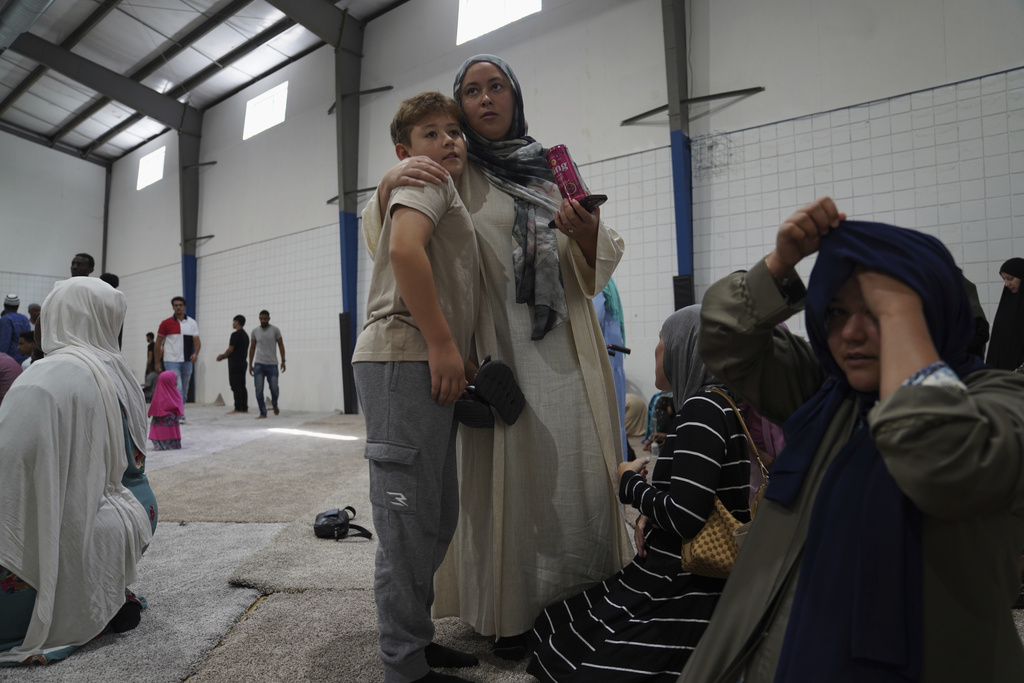 Families attend Friday prayer at the Islamic Center of Cedar Rapids on Friday, Aug. 8, 2025, in Cedar Rapids, Iowa. (AP Photo/Jessie Wardarski)