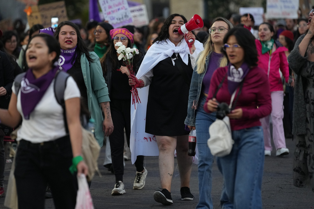 Demonstrators attend a protest marking International Day for the Elimination of Violence Against Women in Quito, Ecuador, Tuesday, Nov. 25, 2025. (AP Photo/Dolores Ochoa)