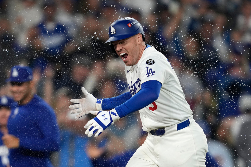 Los Angeles Dodgers' Freddie Freeman rounds the bases after hitting a walk off home run against the Toronto Blue Jays during the 18th inning in Game 3 of baseball's World Series, Monday, Oct. 27, 2025, in Los Angeles. (AP Photo/Ashley Landis)