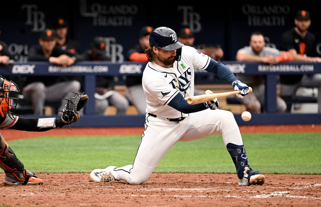 Tampa Bay Rays' Ryan Vilade puts down an RBI sacrifice bunt during the eighth inning of a baseball game against the San Francisco Giants, Sunday, May 3, 2026, in St. Petersburg, Fla. (AP Photo/Jason Behnken)