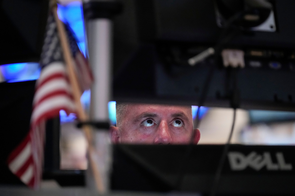 A trader works on the floor of the New York Stock Exchange, Thursday, July 30, 2026, in New York. (AP Photo/Yuki Iwamura)