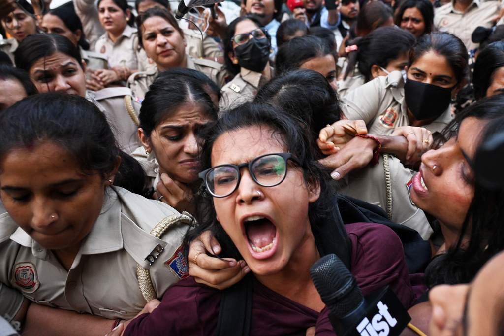 Prominent student leader Neha Bora, center, shouts slogans as she is detained by the police during a youth demonstration demanding the resignation of the country's election chief Gyanesh Kumar, in New Delhi, India, Friday, Oct. 16, 2026. (AP Photo/Vipin)