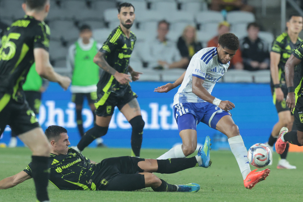 CF Montreal forward Noah Streit, right, steals the ball from Columbus Crew midfielder Dylan Chambost during the second half of an MLS soccer match in Columbus, Ohio, Wednesday, Aug. 19, 2026. (AP Photo/Paul Vernon)