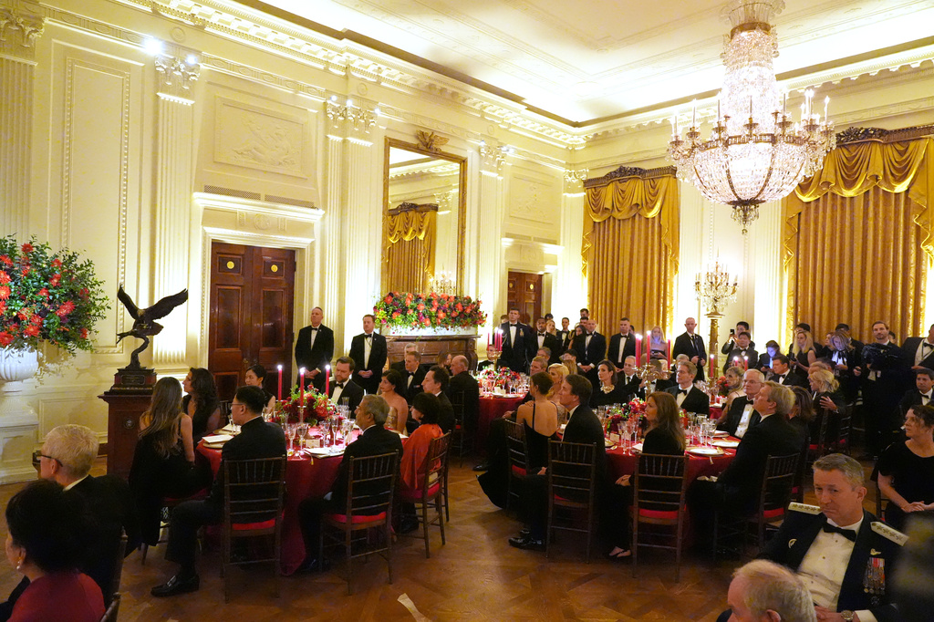 Guests listen during a State Dinner with President Donald Trump and China's President Xi Jinping in the East Room of the White House, Thursday, Sept. 24, 2026, in Washington. (AP Photo/Alex Brandon)