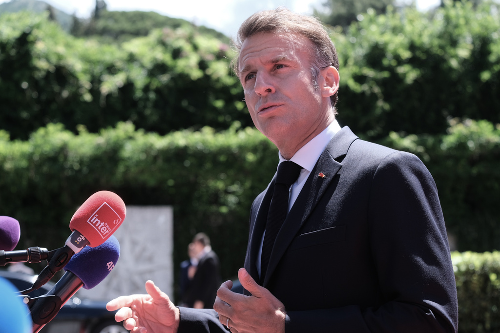 French President Emmanuel Macron speaks with the media as he arrives for the EU-Western Balkans summit in Tivat, Montenegro, Friday, June 5, 2026. (AP Photo/Risto Bozovic)