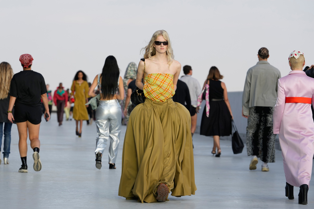 A model wears a creation part of the Moschino women's Spring-Summer 2027 collection, presented in Milan, Italy, Friday, Sept. 25, 2026. (AP Photo/Luca Bruno)
