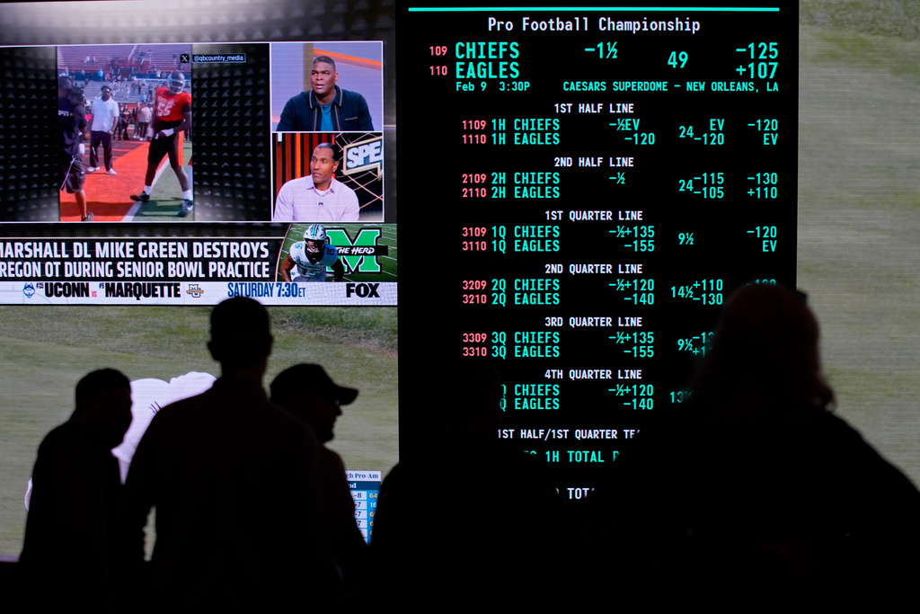 FILE - Betting odds for Super Bowl LIX are displayed on monitors at the Circa resort and casino sports book, Jan. 30, 2025, in Las Vegas. (AP Photo/John Locher, File)