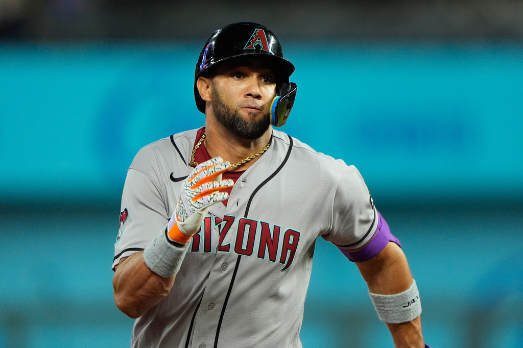 Arizona Diamondbacks' Lourdes Gurriel Jr. runs to third after hitting an RBI triple during the 11th inning of a baseball game against the Kansas City Royals, Tuesday, Sept. 8, 2026, in Kansas City, Mo. (AP Photo/Charlie Riedel)